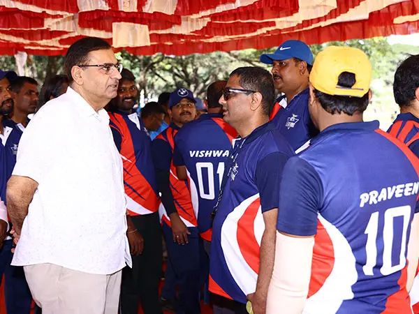 Employee teams huddled at Bioplus Sports Day